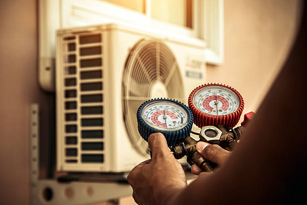 Professional Air Conditioning Service technician working in Atlasburg, PA